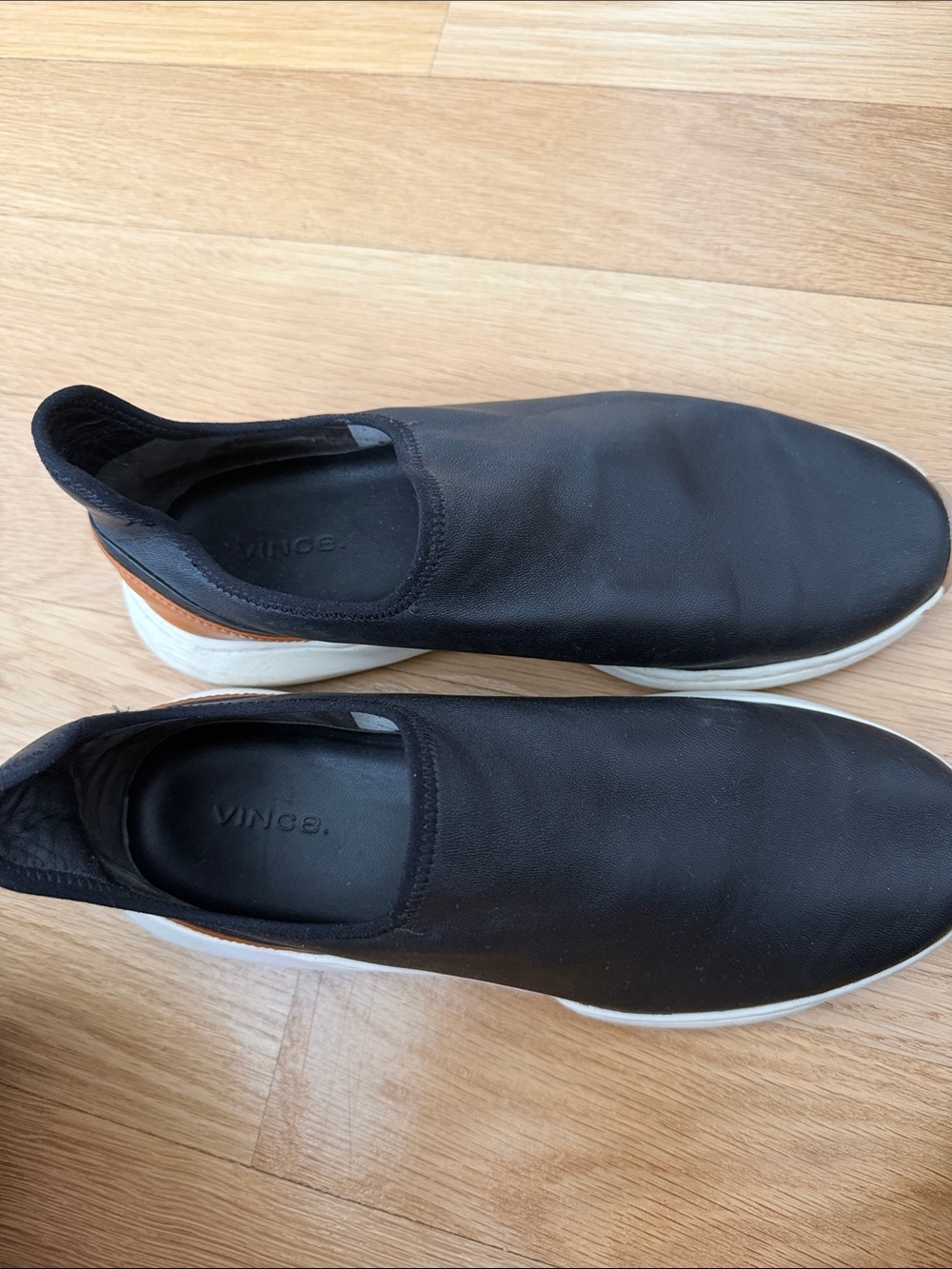 Vince Black Slip-On Sneakers with White Sole and Tan Heel Tab